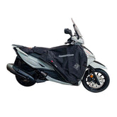 Coprigambe Termoscud R210X, un coprigambe nero con fodera termica. Compatibile con scooter e moto. Di Tucano Urbano.